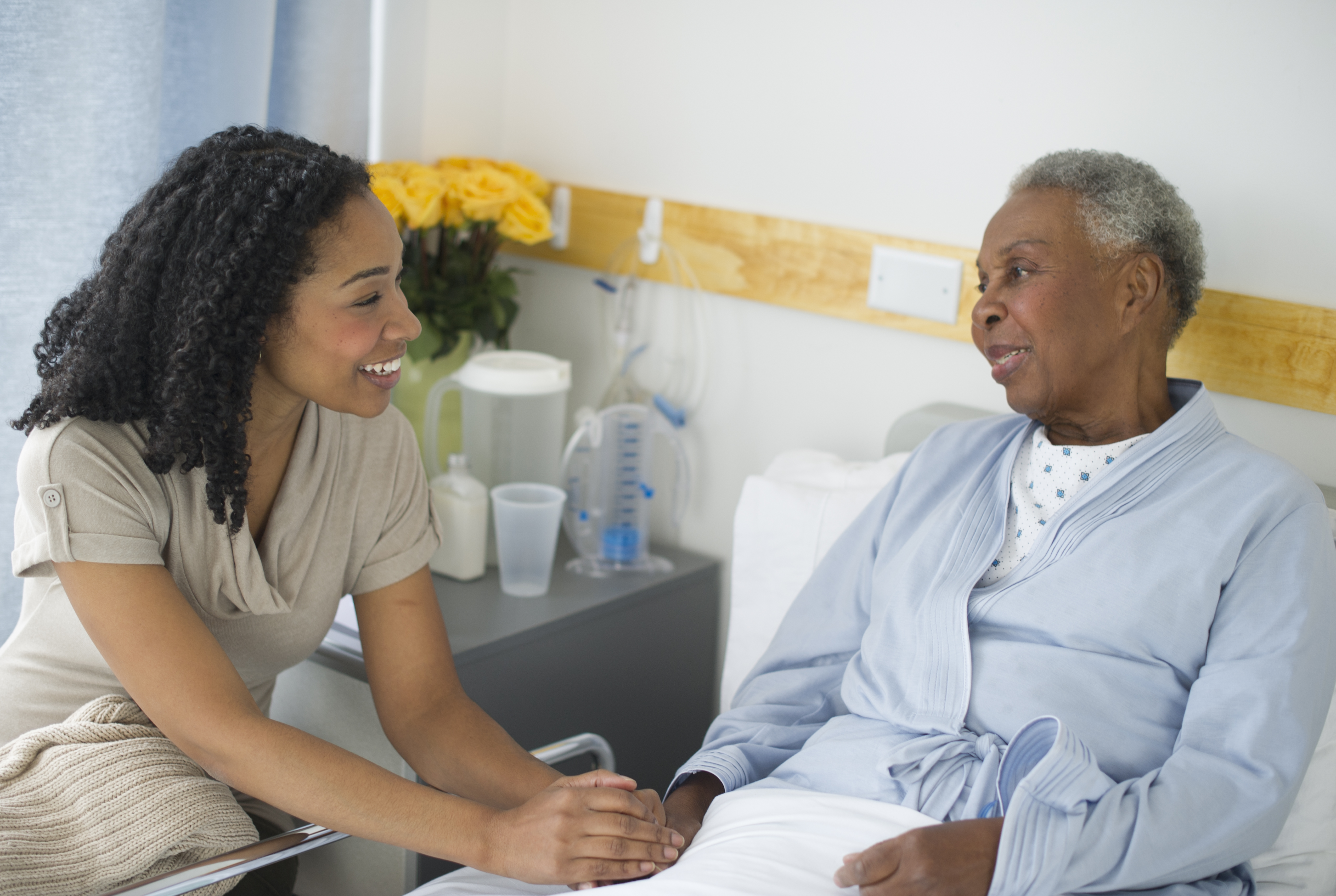 Doctor with patient using digital tablet